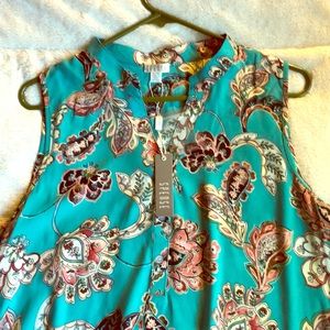 Sleeveless blouse, never worn.
